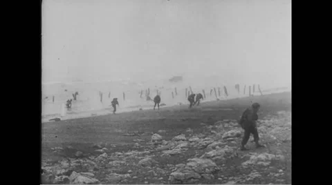 Allied soldiers being attacked by Germans on beach at Normandy Stock Footage