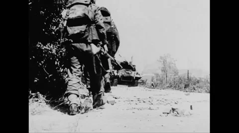 Allied soldiers marching on beach at Normandy Stock Footage 44575433