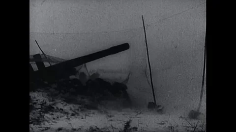 Allied troops engage Axis forces in the snow, firing artillery, flying Stock Footage 139640781