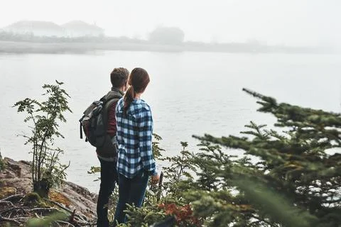 Allow yourself to feel a deep sense of calm. a young couple exploring nature Stockfoto's