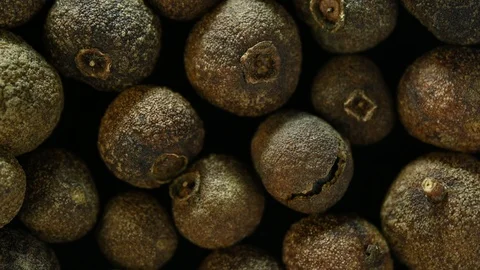 Allspice is spinning on table top view Video stock 120685787