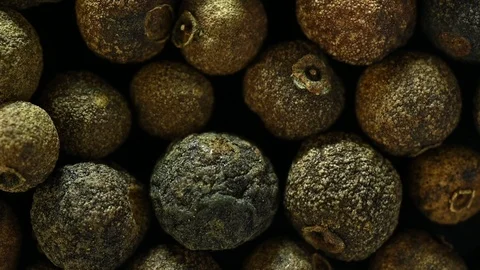 Allspice is spinning on table top view Stock Footage 120685818