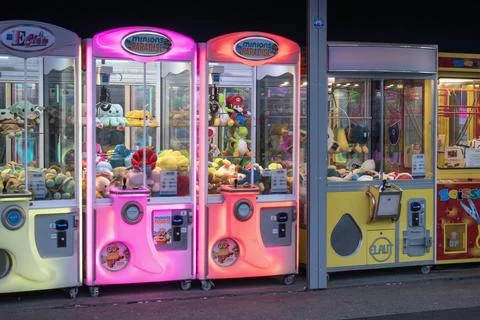 The alluring array of colorful claw machines testing your skills Stock Photos