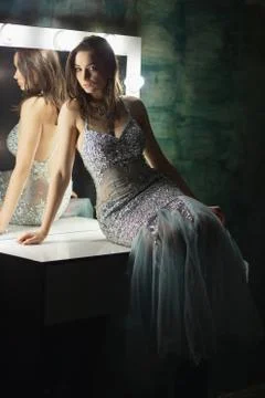 Alluring brunette posing in a studio. Stock Photos