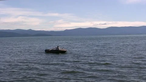 Alluring perspective of Lake Baikal with flickering wave and dazzling sunny sky. Stock Footage 235482322