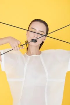Alluring vogue model on yellow Stock Photos