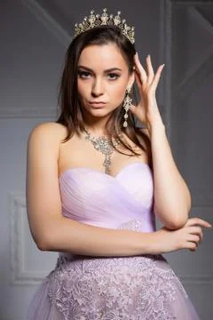 Alluring young brunette posing in the studio. Stock Photos