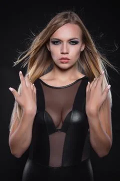 Alluring young lady posing in a studio. Stock Photos