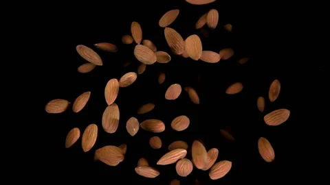Almond bouncing against to the camera Stock Footage 88734124