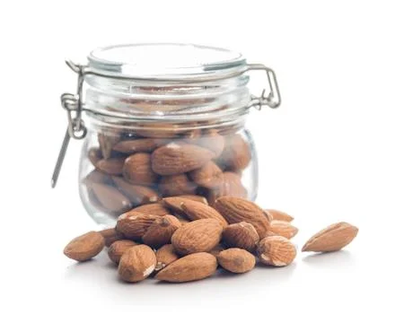 Almond kernel nuts isolated on white background. Stock Photos