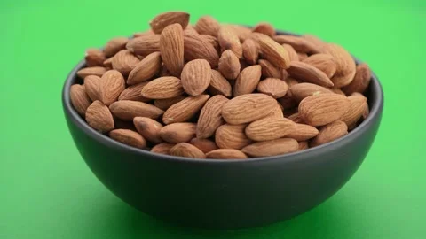 Almond nut close-up, angle view, green screen background, chroma key. Stock Footage 156476119