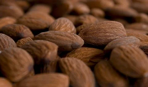 Almond nut, close up. Nut background. Almond texture. Stock Photos