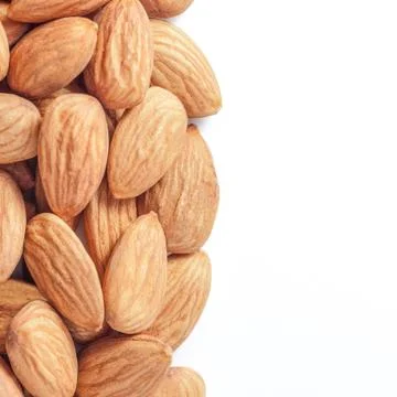 Almond nut close-up, white background, place for inscription Stock Photos
