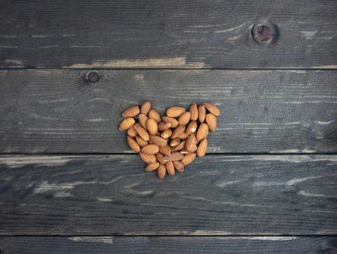Almond nuts on a dark table. View from above Stock Photos