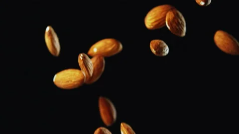 Almond Nuts Falling with Black Background Slow Motion Stock Footage 159710031