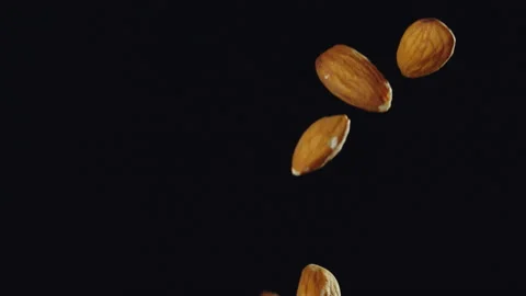 Almond Nuts Falling with Black Background Slow Motion Stock Footage 159710821