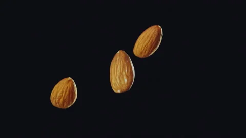 Almond Nuts Falling with Black Background Slow Motion Stock Footage 159721242