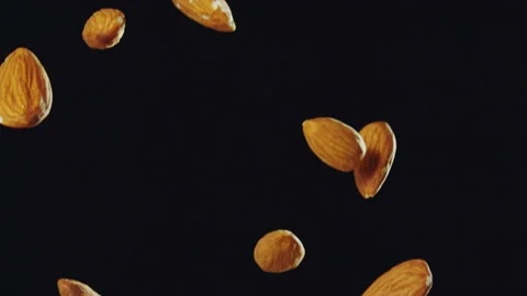 Almond Nuts Falling with Black Background Slow Motion Stock Footage 159721335