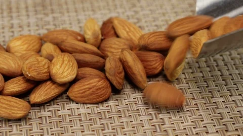 Almond nuts lie in a wide stripe Stock Footage 123794995