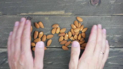Almond nuts sprinkled on a dark table. Stock Footage 138831802