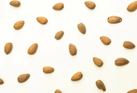 Almond nuts on white table, top view.  Stock Photos