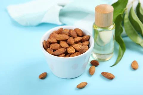 Almond oil on the table close up Stock Photos
