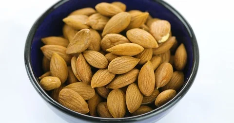 Almond rotating on white background Stock Footage 102397040