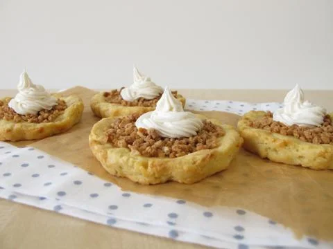 Almond tartlets withe cake cream Stock Photos
