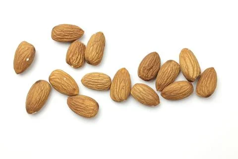 Almond on white Stock Photos