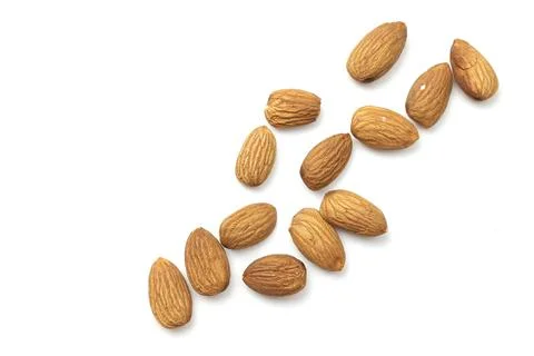 Almond on white Fotos de archivo
