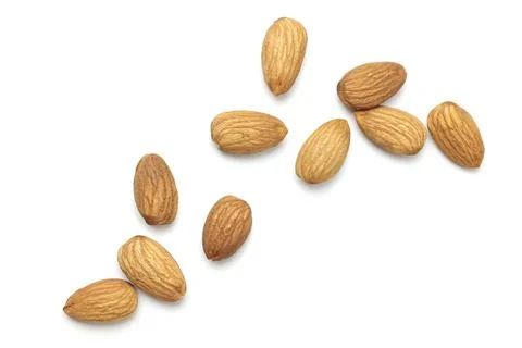 Almond on white Stock Photos
