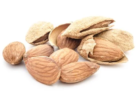 Almonds and almond shells on white background Stock Photos