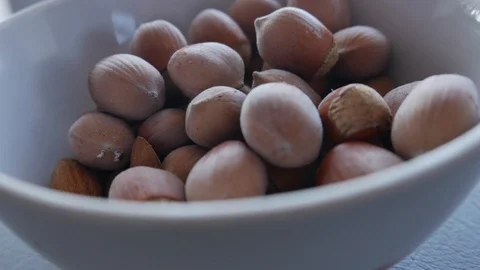 Almonds and Hazelnuts Macro. Hazelnut Falling to Almonds. Food Detail Stock Footage 118954876