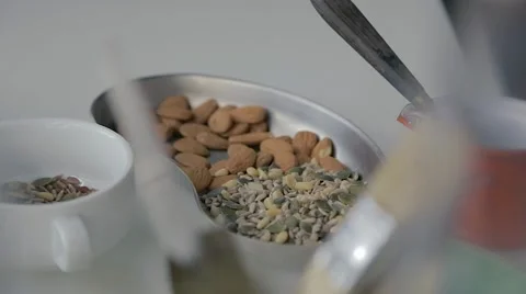 Almonds and healthy seeds in metallic container Stock Footage