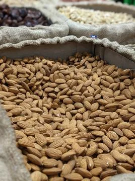 Almonds in a bag. Nuts. Stock Photos