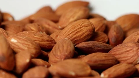 Almonds beeing dropped from above Stock Footage 153870604