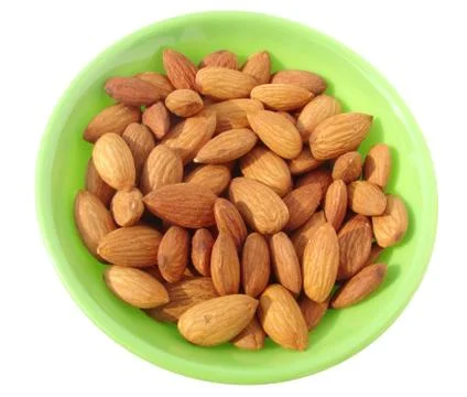 Almonds in bowl Stock Photos
