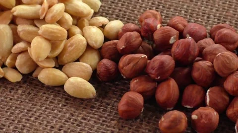 Almonds, cashew, walnuts and hazelnuts lying on burlap Stock-Footage 61206865