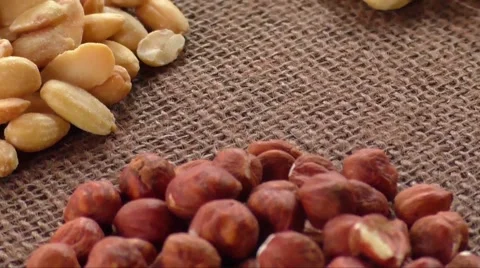 Almonds, cashew, walnuts and hazelnuts lying on burlap Stock Footage 61512045