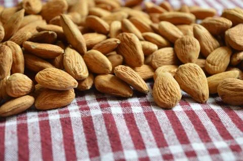 Almonds on a checkered background Stock Photos