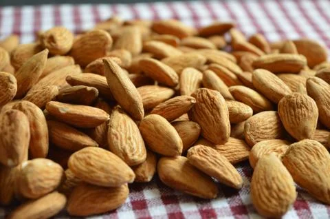 Almonds on a checkered background Stock Photos