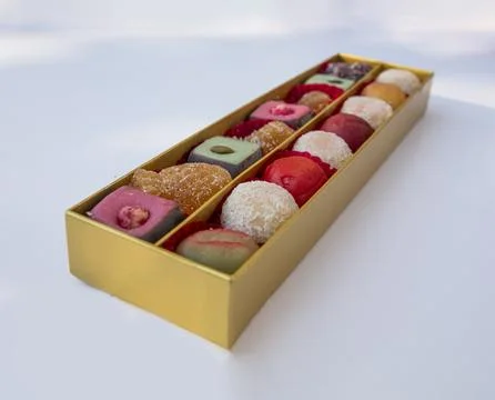 Almonds, chocolate, coconuts sweets in box Stock Photos