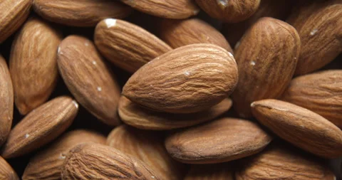 Almonds close up studio shot over rotating Stock Footage 324837145