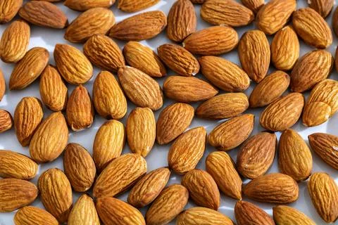 Almonds creating a full frame pattern. Healthy food, snack, and ingredient .. Stock Photos