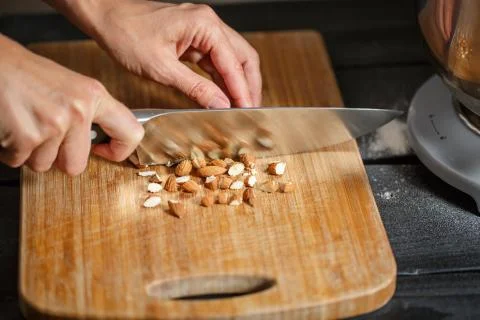Almonds cutting knife Stock Photos