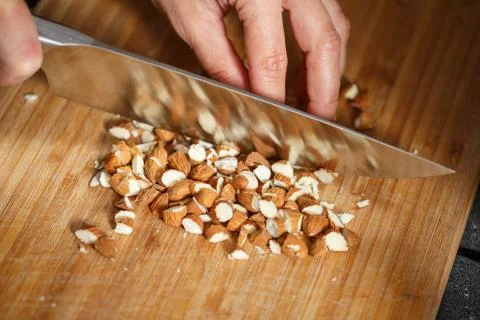 Almonds cutting knife Stock Photos