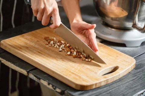 Almonds cutting knife Stock Photos