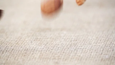 Almonds Dropping On Canvas, Slow Motion 250 FPS Видео 92126655