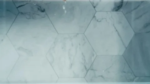 Almonds dropping into water Stock Footage 129671321