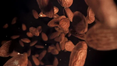 The almonds fall down. Filmed on a high-... | Stock Video | Pond5